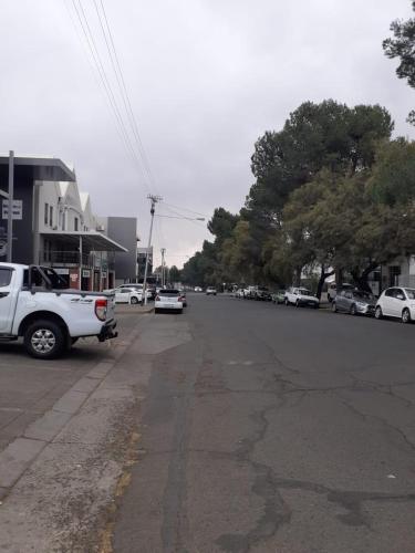 a white truck parked on the side of a street at Gracious Beauty in Bloemfontein