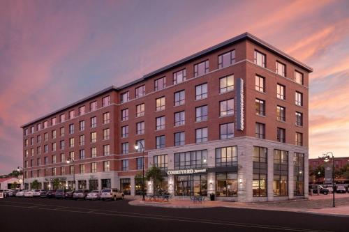 a large brick building on a city street at Courtyard by Marriott Portland Downtown/Waterfront in Portland