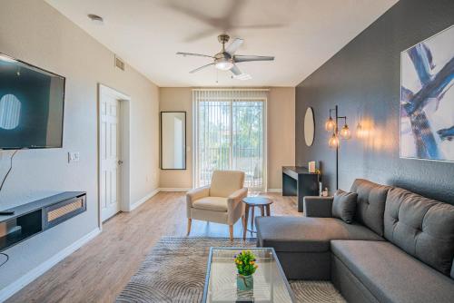 a living room with a couch and a table at Spacious 2BD - ASU - Sloan Pk - WD Parking Sleeps 8 in Tempe
