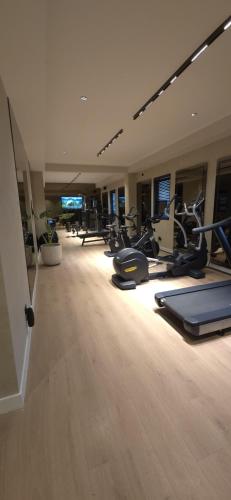 a gym with rows of exercise bikes in a room at La Residence Panamá in Panama City