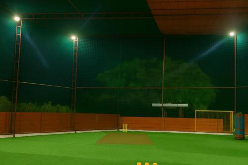 a tennis court at night with lights on it at Heaven Stay Resort in Shankerpalli