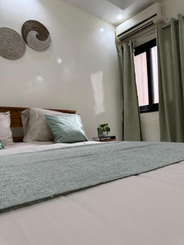 Ένα ή περισσότερα κρεβάτια σε δωμάτιο στο Cozy Beach Apartment in Ngor