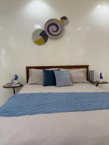 Ένα ή περισσότερα κρεβάτια σε δωμάτιο στο Cozy Beach Apartment in Ngor