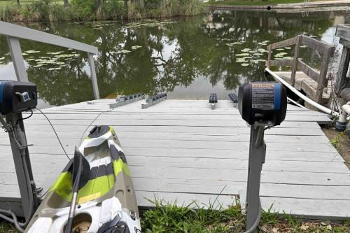 a parking meter on a dock next to a body of water at Bay Point Paradise in Horseshoe Bay