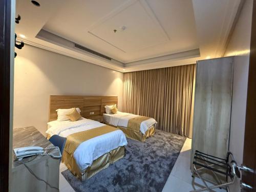 Postel nebo postele na pokoji v ubytování راحة ترف Chicnest