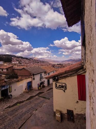 a view of a town from a building at Loki Cusco in Cusco
