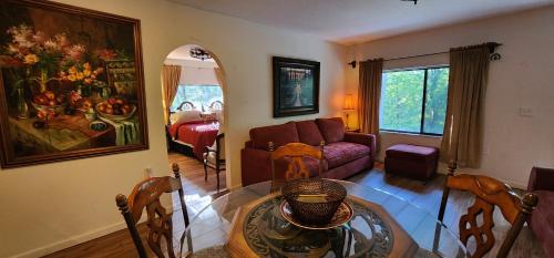 a living room with a couch and a table at Lily Creek Lodge in Dahlonega