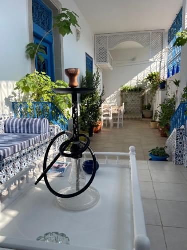 a bike on a stand in the middle of a room at BALKIS La RÊNE DE SABA in Sidi Bou Saïd