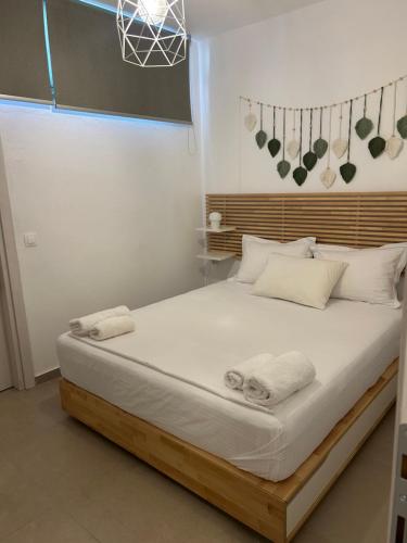 En eller flere senge i et værelse på Villa Aurora