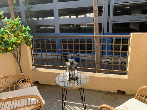 a table on a balcony with a view of a street at Luxury Hollywood Stay Beautiful 2Beds2Baths in Los Angeles