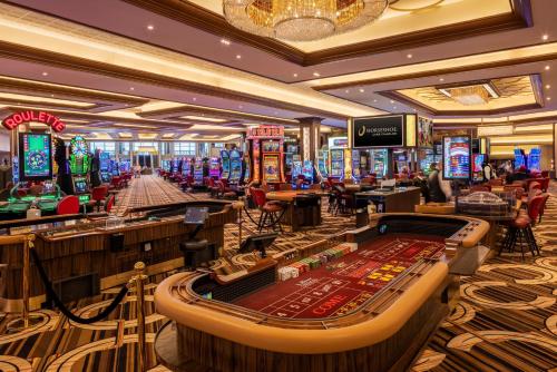 a casino with a bunch of slot machines at Horseshoe Lake Charles, A Caesars Destination in Lake Charles