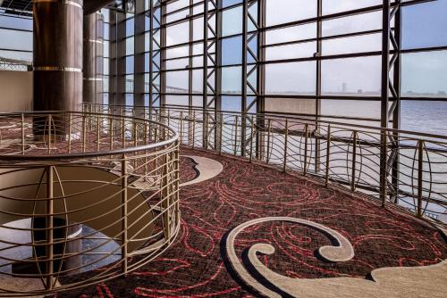 a room with a carpeted floor and a large window at Horseshoe Lake Charles, A Caesars Destination in Lake Charles