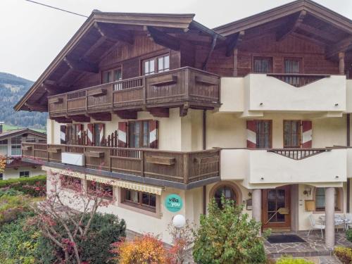 a large building with wooden balconies on it at Oberleitner L in Brixen im Thale