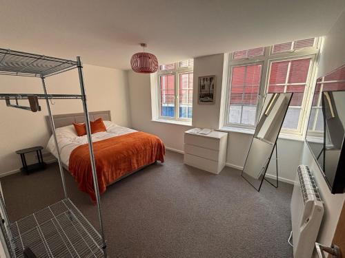 a bedroom with a bunk bed and a mirror at New City Centre Flat No 1 2 Bedrooms Free Parking in Leicester