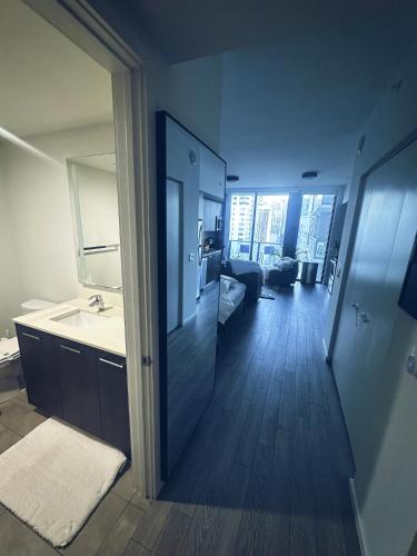 a bathroom with a sink and a mirror at Luxe Ventures Miami in Miami