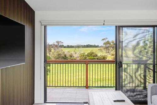 an open door to a balcony with a view at Luxury Hills Villa Retreat Phillip Island Resort in Cowes