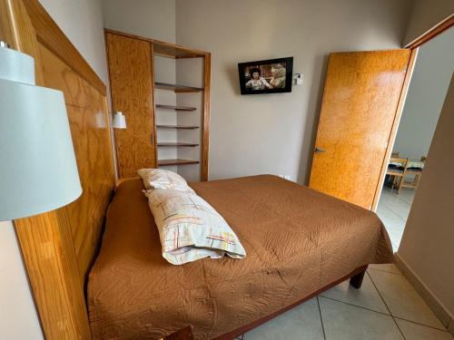 a bedroom with a bed with a pillow on it at Privada 400 in Pachuca de Soto
