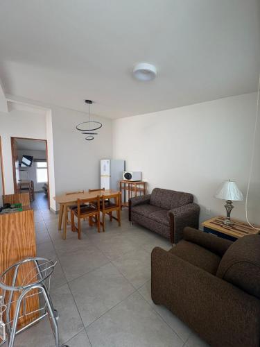 a living room with two couches and a table at Privada 400 in Pachuca de Soto
