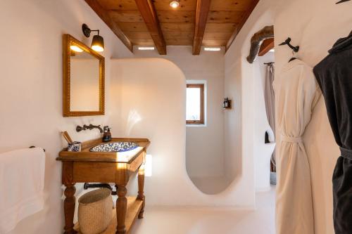 a bathroom with a sink and a mirror at NEST Baja in San José del Cabo