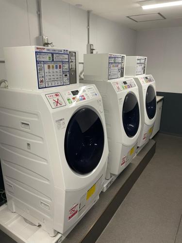 a row of washing machines on display in a store at ANA Crowne Plaza Kobe by IHG in Kobe