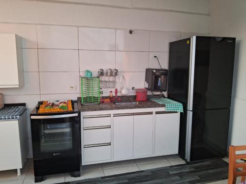 Köök või kööginurk majutusasutuses Cobertura Ubatuba