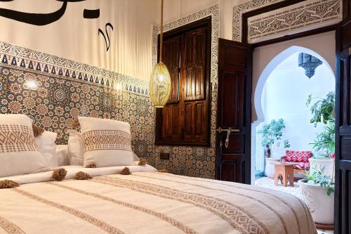 a bedroom with a large bed in a room at Dar Salam Palm - Guest Choice Award 2024 in Marrakech