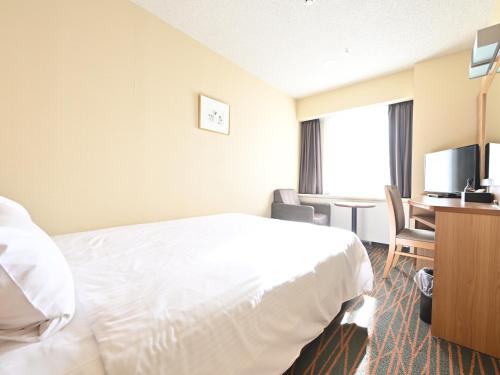 Ένα ή περισσότερα κρεβάτια σε δωμάτιο στο Hotel Abest Sapporo