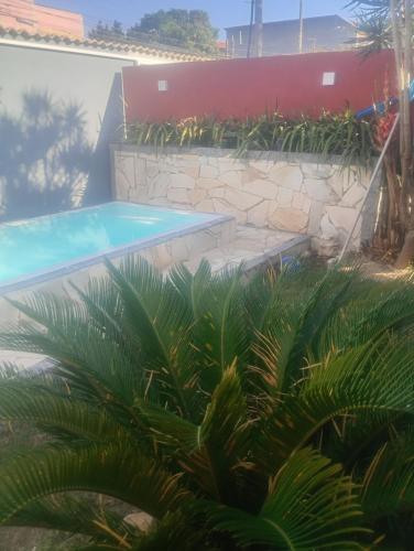 Der Swimmingpool an oder in der Nähe von Casa Cris cabo frio
