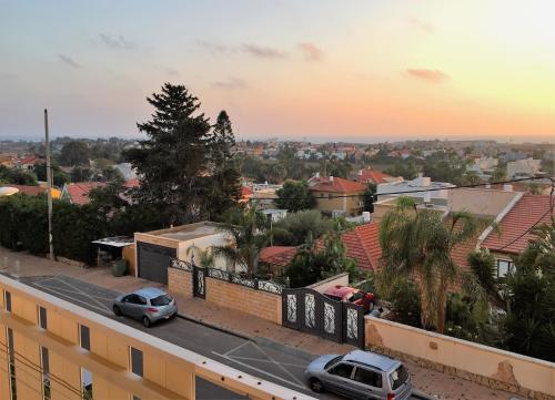 a view of a city with cars parked on a street at 2 bedroom apartment in Atlit, Haifa district in Atlit
