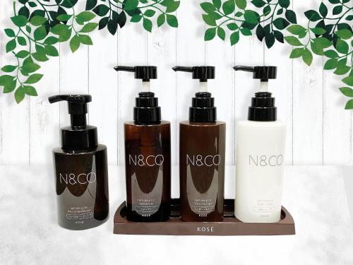 a group of four bottles of hair products on a shelf at MAX CUBE Mooka in Mooka