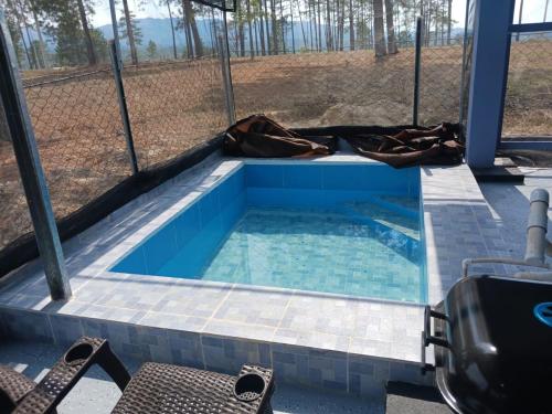 a small swimming pool with a fence around it at One Wish in Siguatepeque
