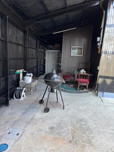 a bbq grill in a building with a patio at 多賀三宿 in Taga
