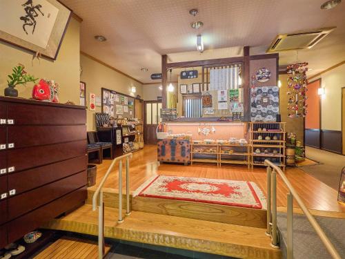 a store lobby with a rug on the floor at Oyado Yumechidori in Saga