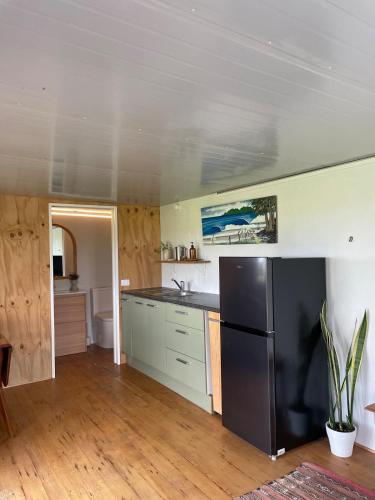 Kuchyň nebo kuchyňský kout v ubytování Cosy Cabin -Off Grid