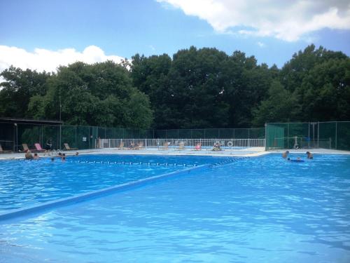 a large swimming pool with people in the water at Lake Myers Lakeside Villa 16 in Mocksville