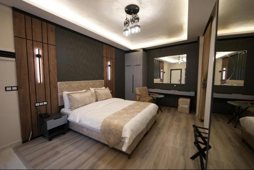 Ένα ή περισσότερα κρεβάτια σε δωμάτιο στο Milena Otel