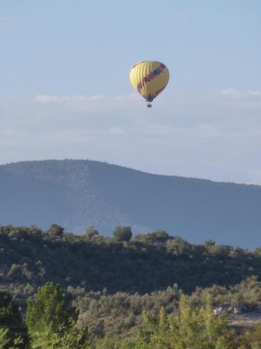 a hot air balloon flying in the sky at Verde Valley Studio Cabin 2 in Cottonwood