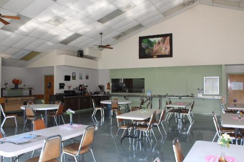 a large room with tables and chairs in it at Verde Valley Canyon View Cottage 3 in Cottonwood