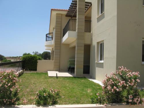 a view of a building with a yard at Pyla Gardens D5 in Pyla