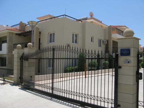 a house with a gate in front of it at Pyla Gardens D5 in Pyla