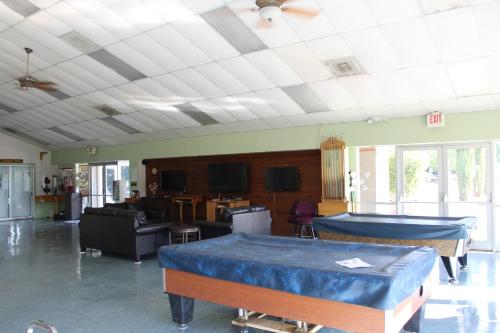 a room with two beds and a living room at Verde Valley Studio Cabin 1 in Cottonwood