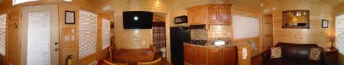 a room with a kitchen with a stove in it at Verde Valley Deck Cottage 7 in Cottonwood