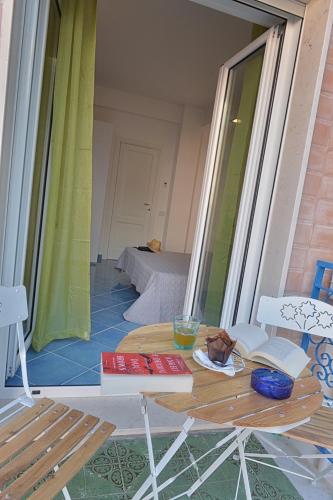 a room with a table and chairs and a window at Acquamarine Maiori Amalfi Coast in Maiori