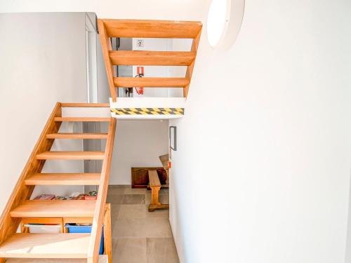 a room with a bunk bed and a ladder at Holiday home in HUY near town center in Huy