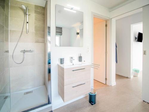 a bathroom with a sink and a shower at Holiday home in HUY near town center in Huy