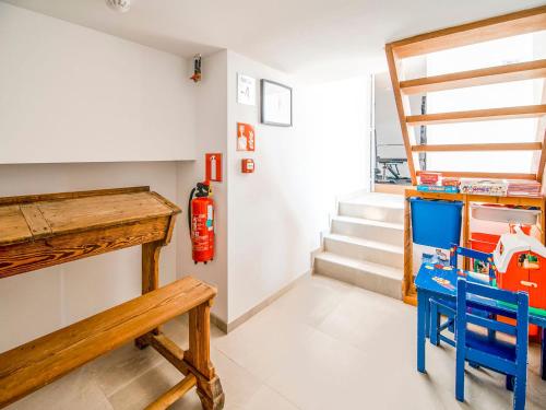 a room with stairs and a table and a lego house at Holiday home in HUY near town center in Huy