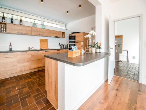 a kitchen with a large island in the middle at Holiday home in HUY near town center in Huy
