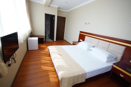 Postel nebo postele na pokoji v ubytování Hotel 725