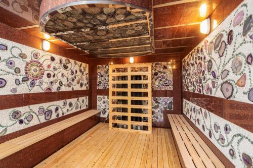 a wine tasting room with a wall of wine bottles at Taebaek Hotel in Taebaek
