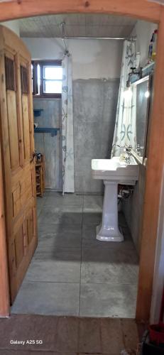 a bathroom with a sink and a mirror at Farma Hermína in Jilemnice